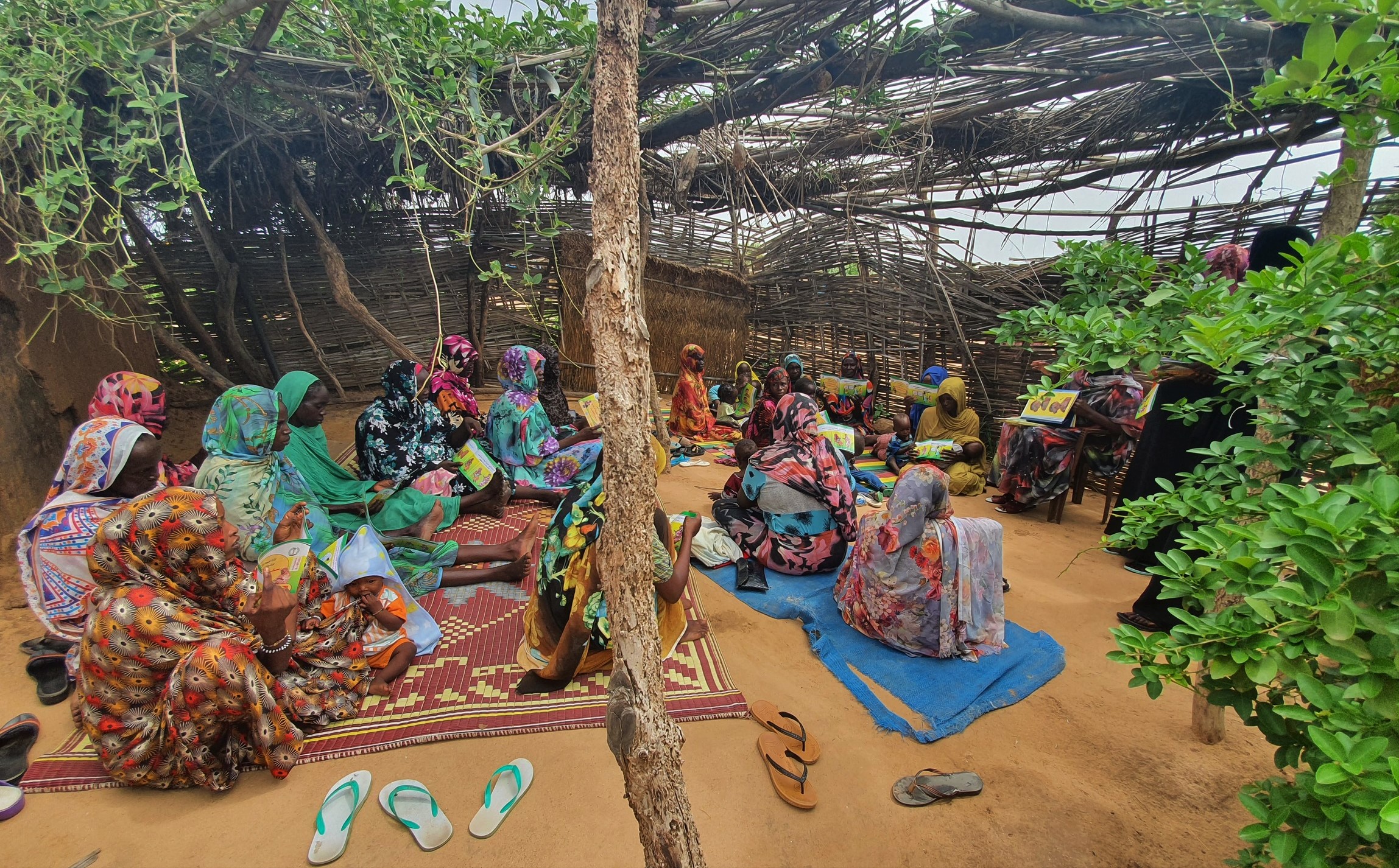 Community peer support group meets outside of Khartoum